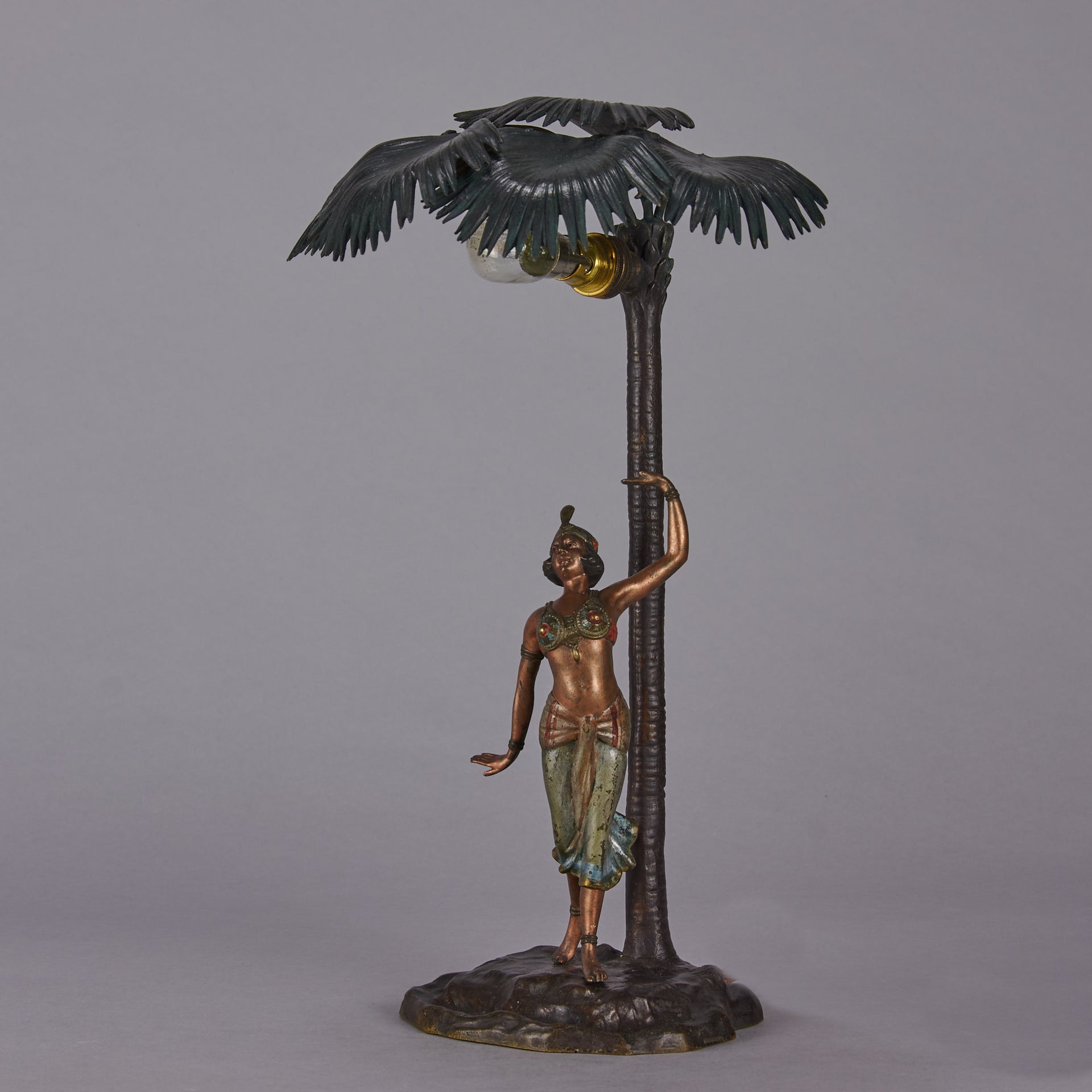 Woman Under Palm Tree Lamp by Franz Bergman Very fine early 20th Century Vienna bronze table lamp modelled as an Orientalist dancer by the side of a palm tree fitted with a light under its palms