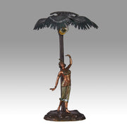 Woman Under Palm Tree Lamp by Franz Bergman Very fine early 20th Century Vienna bronze table lamp modelled as an Orientalist dancer by the side of a palm tree fitted with a light under its palms