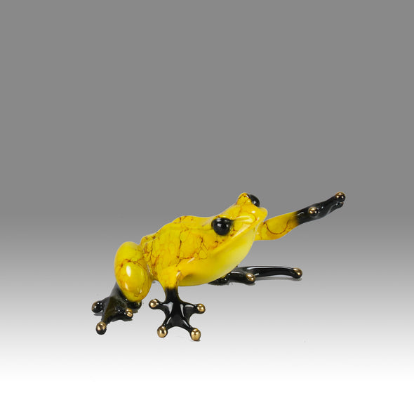 Chai - A vibrant limited edition bronze sculpture by Tim Cotterill of a yellow frog with its head raised, reaching out with its front leg, exhibiting very fine bright enamel colours and excellent tactile surface