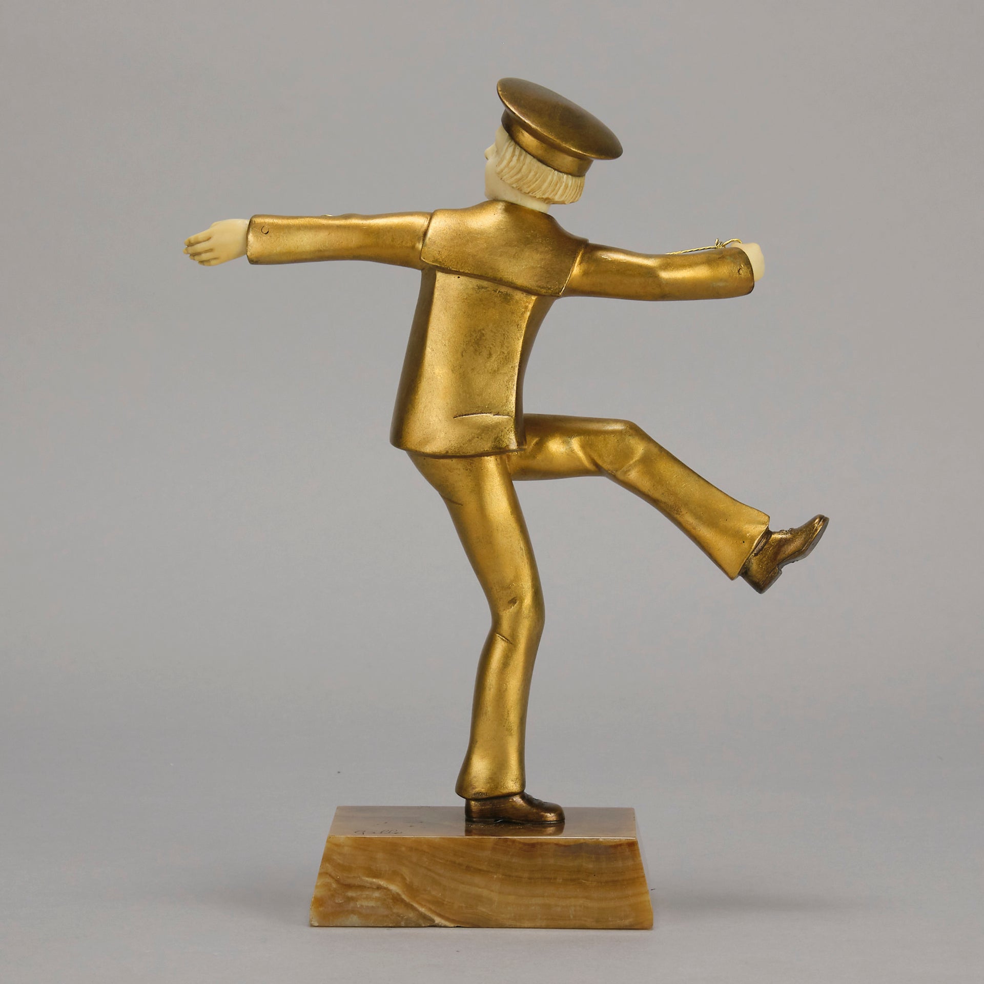 Art Deco Bronze Figurine Yo Yo by Gallo Gilt Bronze Sculpture of a young man dressed in period sailor boy attire performing tricks with his yo-yo whilst balancing on one leg. The figure with excellent hand carved detail and fine golden colour 