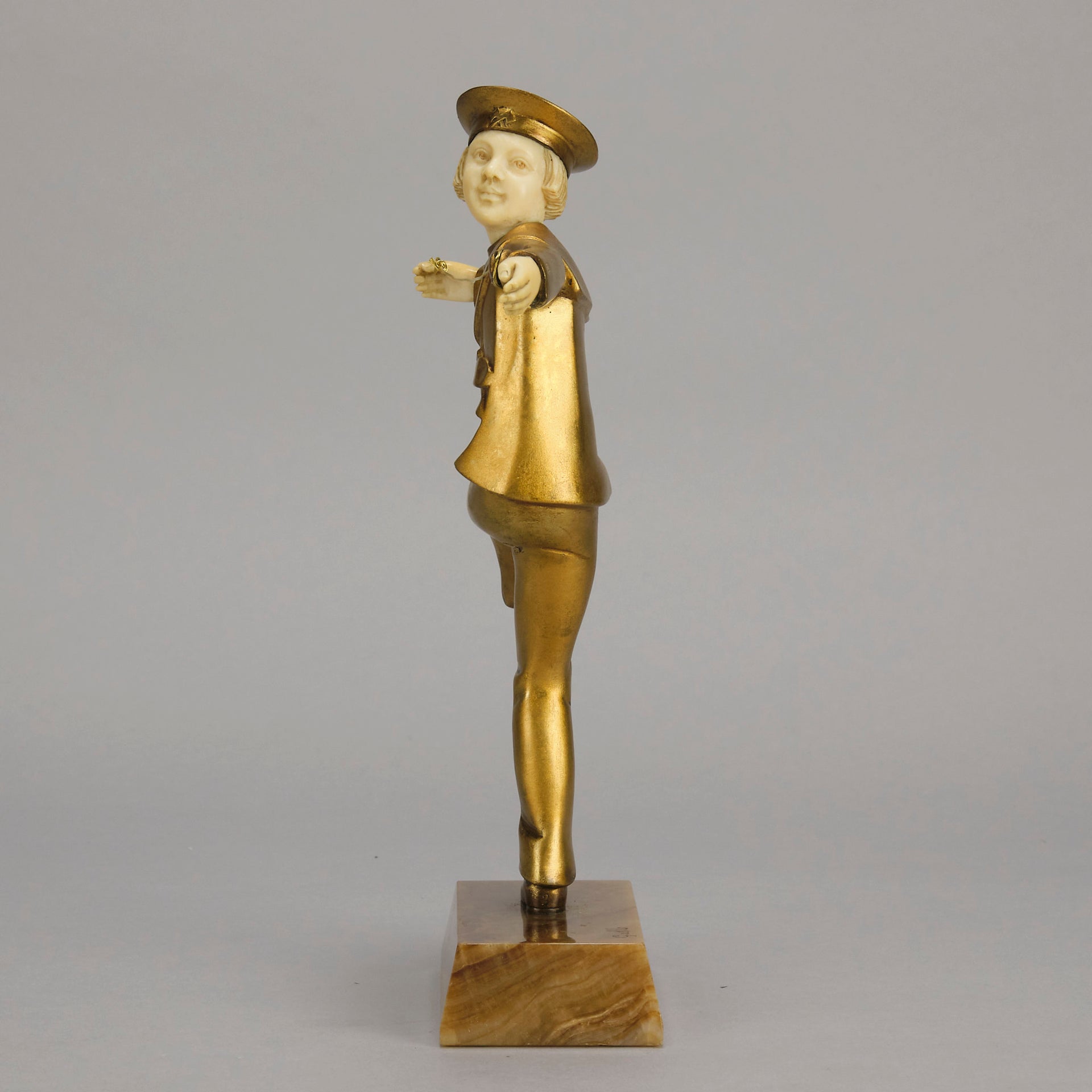 Art Deco Bronze Figurine Yo Yo by Gallo Gilt Bronze Sculpture of a young man dressed in period sailor boy attire performing tricks with his yo-yo whilst balancing on one leg. The figure with excellent hand carved detail and fine golden colour 