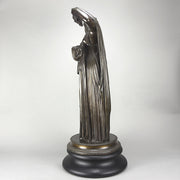 Callipygian Venus an Antique Bronze Figure depicting a partially draped woman, raising her light peplos (draped clothing) to uncover her hips and buttocks, and looking back and down over her shoulder