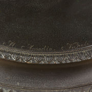 Callipygian Venus an Antique Bronze Figure depicting a partially draped woman, raising her light peplos (draped clothing) to uncover her hips and buttocks, and looking back and down over her shoulder