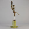 Charlotte by Josef Lorenzl a fabulous early 20th Century Art Deco cold painted bronze figure of a young woman holding an energetic pose lifting her shawl which is wrapped around her midriff.