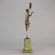 Charlotte by Josef Lorenzl a fabulous early 20th Century Art Deco cold painted bronze figure of a young woman holding an energetic pose lifting her shawl which is wrapped around her midriff.
