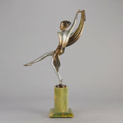 Charlotte by Josef Lorenzl a fabulous early 20th Century Art Deco cold painted bronze figure of a young woman holding an energetic pose lifting her shawl which is wrapped around her midriff.