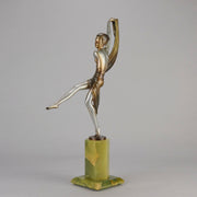 Charlotte by Josef Lorenzl a fabulous early 20th Century Art Deco cold painted bronze figure of a young woman holding an energetic pose lifting her shawl which is wrapped around her midriff.