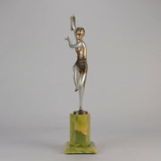 Charlotte by Josef Lorenzl a fabulous early 20th Century Art Deco cold painted bronze figure of a young woman holding an energetic pose lifting her shawl which is wrapped around her midriff.