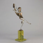 Charlotte by Josef Lorenzl a fabulous early 20th Century Art Deco cold painted bronze figure of a young woman holding an energetic pose lifting her shawl which is wrapped around her midriff.