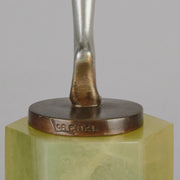 Charlotte by Josef Lorenzl a fabulous early 20th Century Art Deco cold painted bronze figure of a young woman holding an energetic pose lifting her shawl which is wrapped around her midriff.