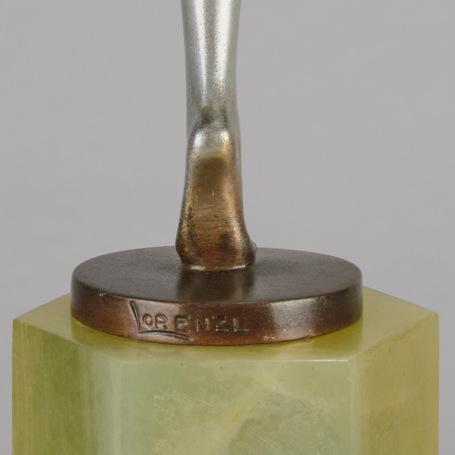 Charlotte by Josef Lorenzl a fabulous early 20th Century Art Deco cold painted bronze figure of a young woman holding an energetic pose lifting her shawl which is wrapped around her midriff.