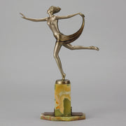 Dancer with Shawl by Josef Lorenzl art deco bronze figurine of a dancer holding an energetic pose wearing nothing but a shawl around her waist. The bronze exhibiting excellent colour and very fine hand chased surface detail, raised on a green onyx base