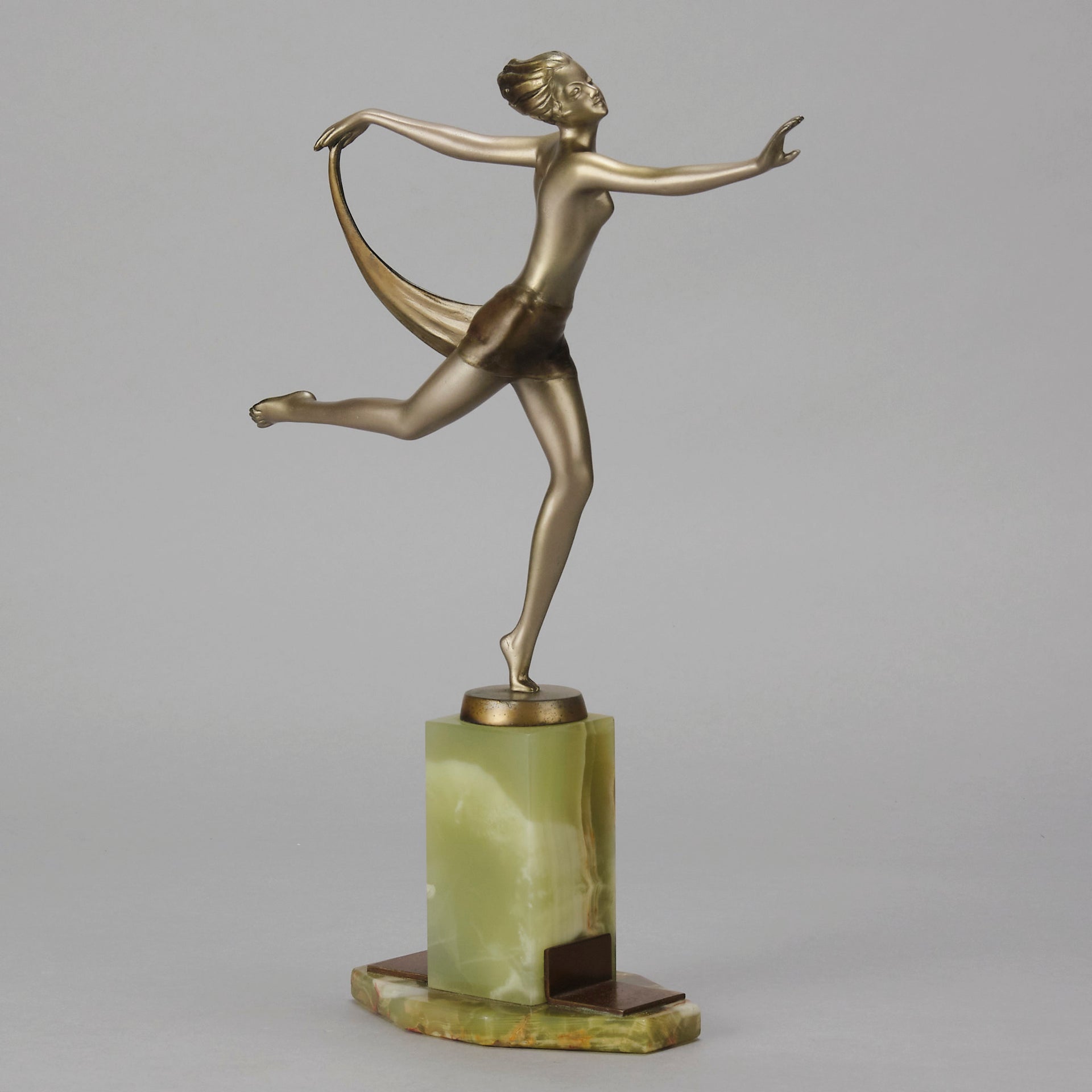Dancer with Shawl by Josef Lorenzl art deco bronze figurine of a dancer holding an energetic pose wearing nothing but a shawl around her waist. The bronze exhibiting excellent colour and very fine hand chased surface detail, raised on a green onyx base