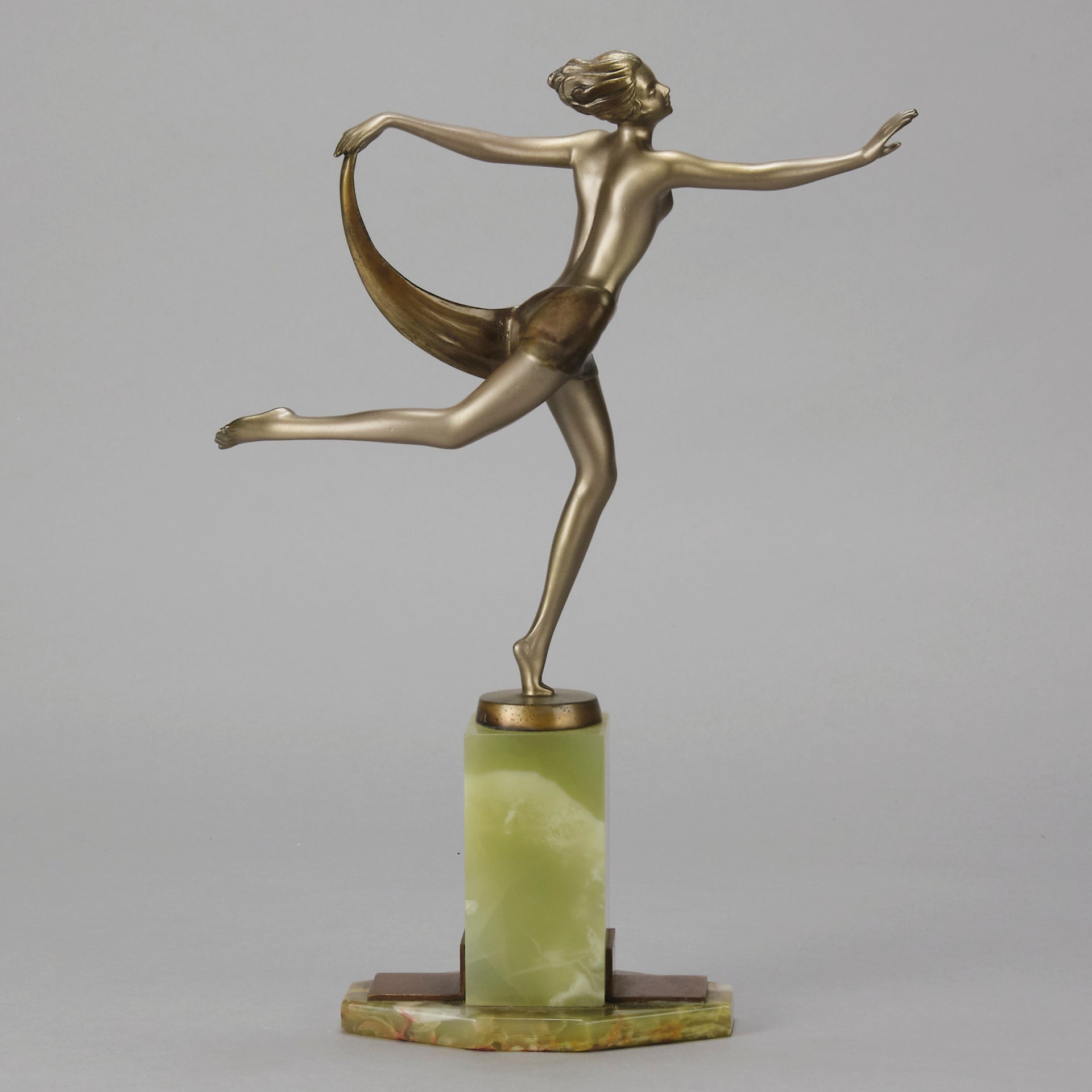 Dancer with Shawl by Josef Lorenzl art deco bronze figurine of a dancer holding an energetic pose wearing nothing but a shawl around her waist. The bronze exhibiting excellent colour and very fine hand chased surface detail, raised on a green onyx base