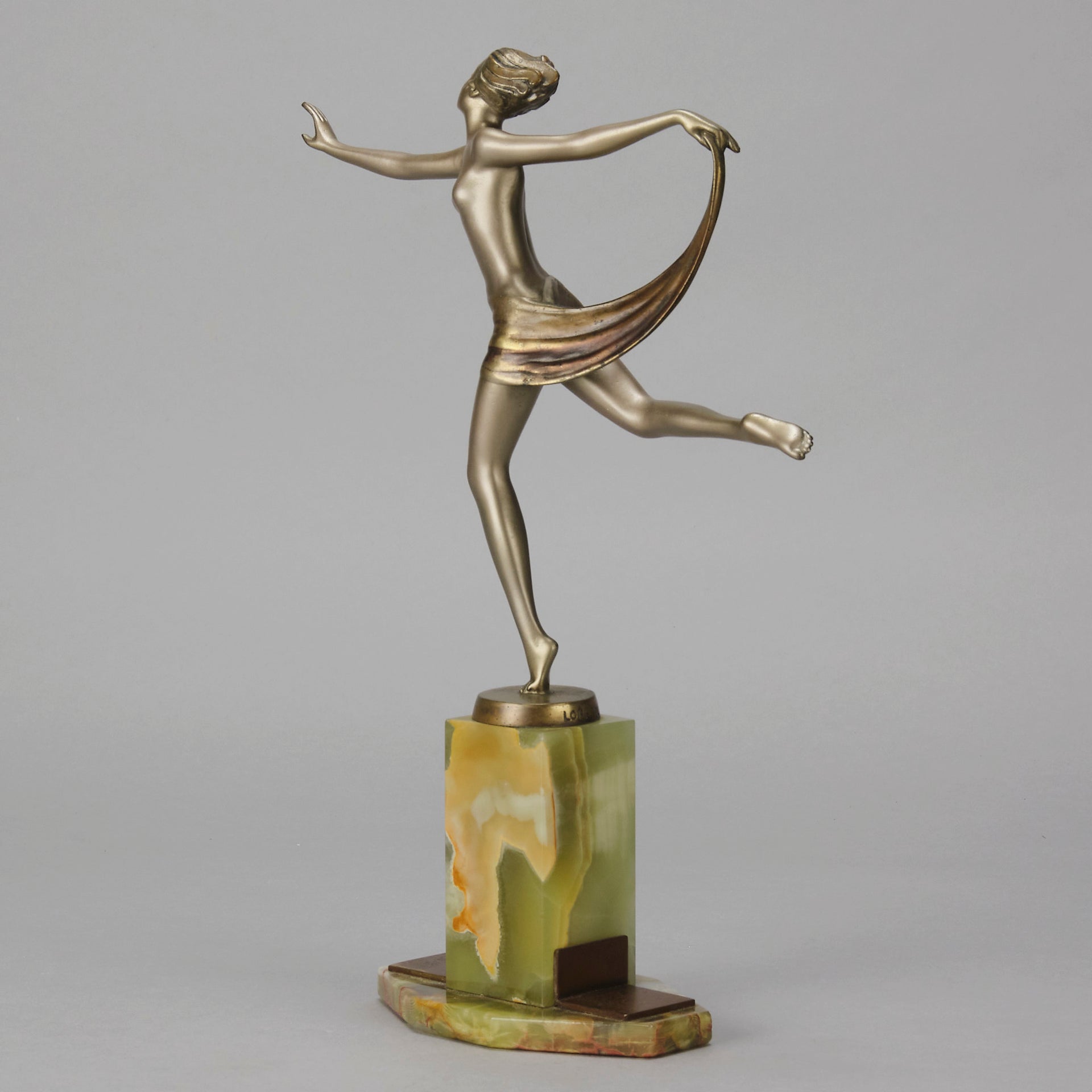 Dancer with Shawl by Josef Lorenzl art deco bronze figurine of a dancer holding an energetic pose wearing nothing but a shawl around her waist. The bronze exhibiting excellent colour and very fine hand chased surface detail, raised on a green onyx base
