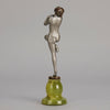 Art Deco Sculpture - Deco Dancer  by Josef Lorenzl  a cold painted bronze figure of a young woman holding a dancing pose with her hands lifted across her chest. The bronze figure with excellent colour and very fine hand chased surface detail, raised on a green onyx base  