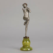 Art Deco Sculpture - Deco Dancer  by Josef Lorenzl  a cold painted bronze figure of a young woman holding a dancing pose with her hands lifted across her chest. The bronze figure with excellent colour and very fine hand chased surface detail, raised on a green onyx base  