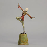 Helga by Josef Lorenzl An Art Deco Bronze and ivory igure of a beautiful dancer holding an elegant pose exhibiting excellent colour and very fine hand chased surface detail, raised on a green onyx base 