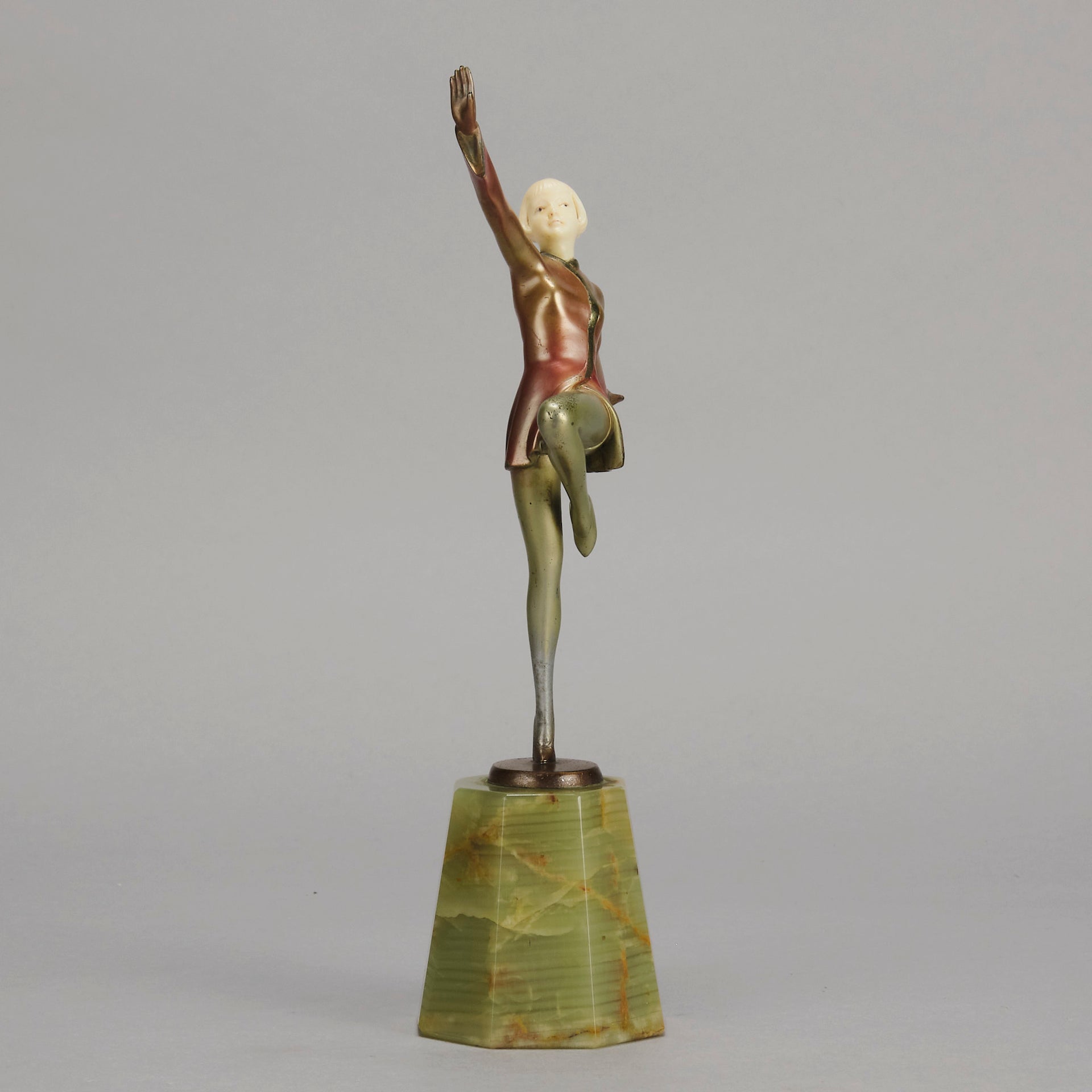 Helga by Josef Lorenzl An Art Deco Bronze and ivory igure of a beautiful dancer holding an elegant pose exhibiting excellent colour and very fine hand chased surface detail, raised on a green onyx base 