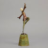 Helga by Josef Lorenzl An Art Deco Bronze and ivory igure of a beautiful dancer holding an elegant pose exhibiting excellent colour and very fine hand chased surface detail, raised on a green onyx base 