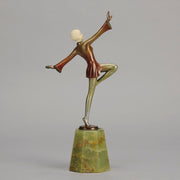 Helga by Josef Lorenzl An Art Deco Bronze and ivory igure of a beautiful dancer holding an elegant pose exhibiting excellent colour and very fine hand chased surface detail, raised on a green onyx base 