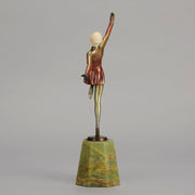 Helga by Josef Lorenzl An Art Deco Bronze and ivory igure of a beautiful dancer holding an elegant pose exhibiting excellent colour and very fine hand chased surface detail, raised on a green onyx base 