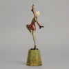 Helga by Josef Lorenzl An Art Deco Bronze and ivory igure of a beautiful dancer holding an elegant pose exhibiting excellent colour and very fine hand chased surface detail, raised on a green onyx base 