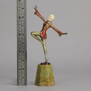 Helga by Josef Lorenzl An Art Deco Bronze and ivory igure of a beautiful dancer holding an elegant pose exhibiting excellent colour and very fine hand chased surface detail, raised on a green onyx base 