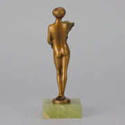 The Bouquet by Joseph Lorenzl an elegant early 20th Century Art Deco cold painted bronze figure of a young beauty holding a large bouquet of flowers covering her modesty raised on a green onyx base 