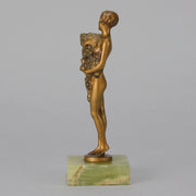 The Bouquet by Joseph Lorenzl an elegant early 20th Century Art Deco cold painted bronze figure of a young beauty holding a large bouquet of flowers covering her modesty raised on a green onyx base 