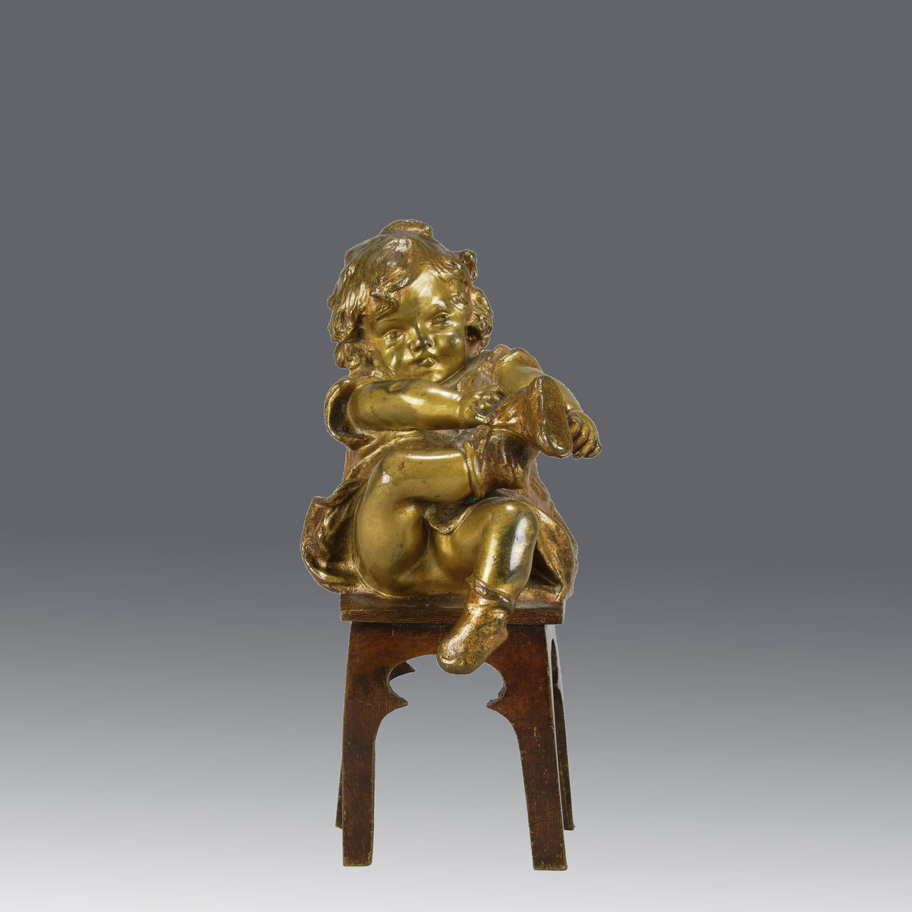 "Girl Putting on her Shoe" by Juan Clara