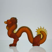 Oriental Dragon by Marie-Claude Lalique A striking mid 20th Century glass study of an Oriental dragon of undulating form with very fine hand chased surface detail and dramatic orange colour