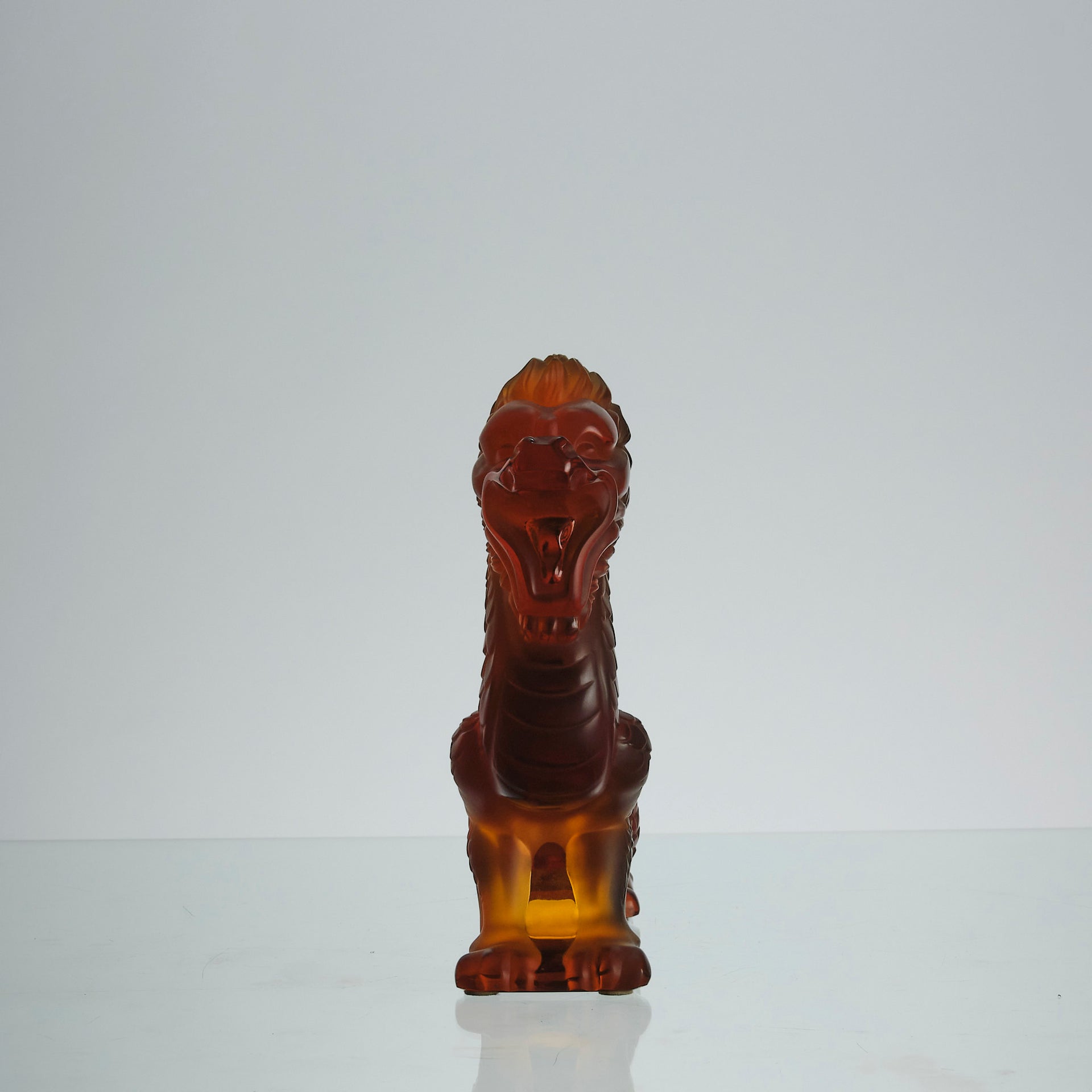 Oriental Dragon by Marie-Claude Lalique A striking mid 20th Century glass study of an Oriental dragon of undulating form with very fine hand chased surface detail and dramatic orange colour