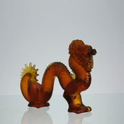 Oriental Dragon by Marie-Claude Lalique A striking mid 20th Century glass study of an Oriental dragon of undulating form with very fine hand chased surface detail and dramatic orange colour
