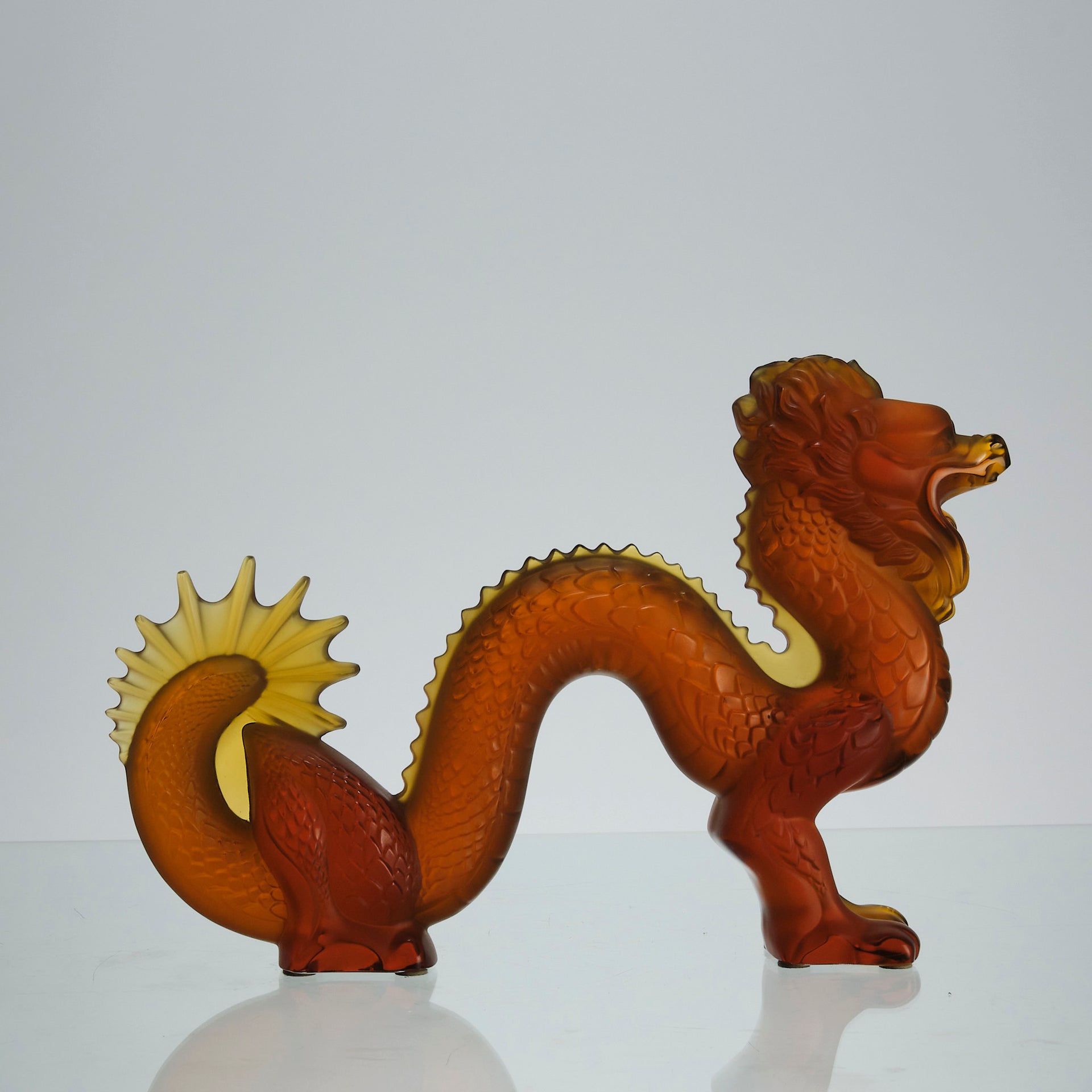 Oriental Dragon by Marie-Claude Lalique A striking mid 20th Century glass study of an Oriental dragon of undulating form with very fine hand chased surface detail and dramatic orange colour