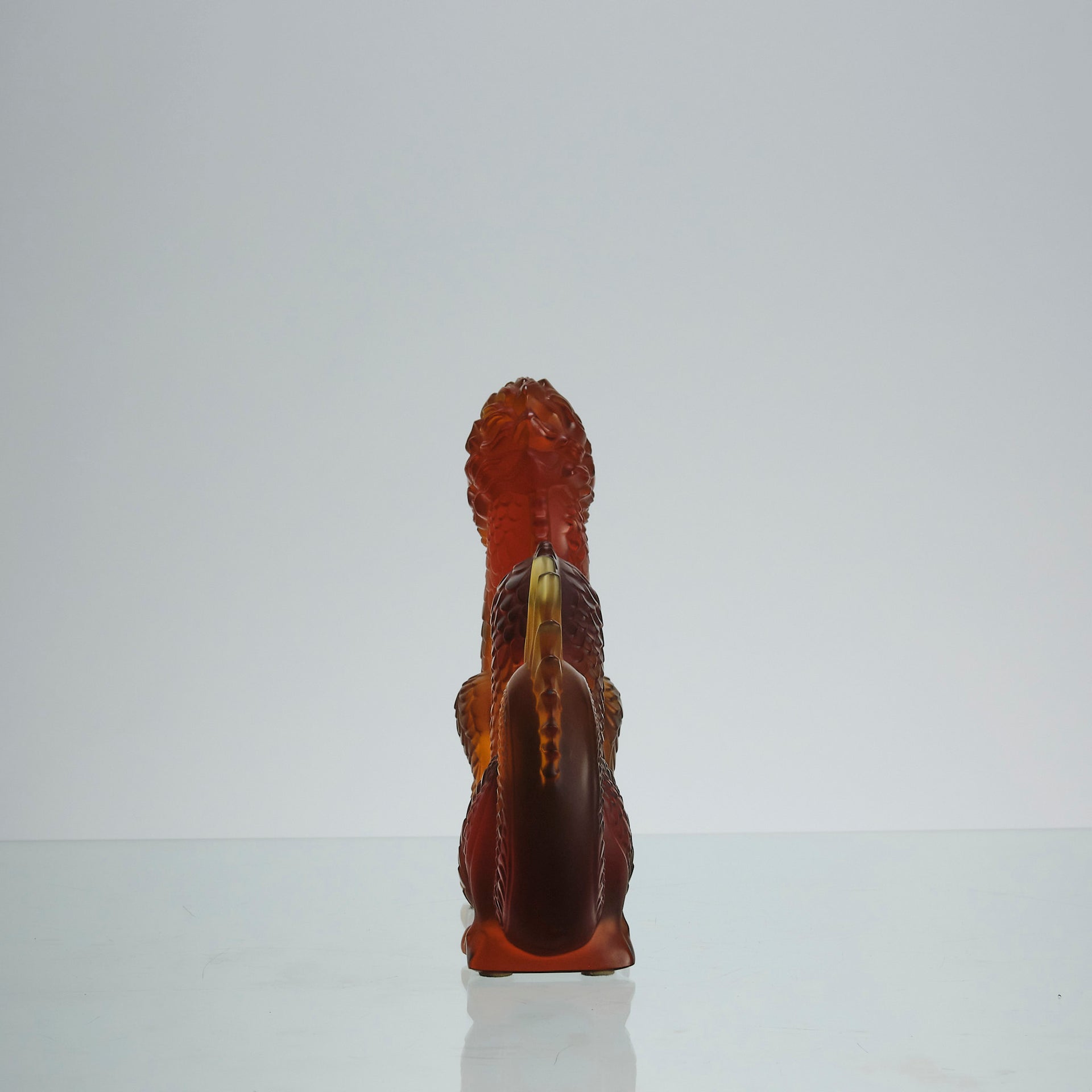 Oriental Dragon by Marie-Claude Lalique A striking mid 20th Century glass study of an Oriental dragon of undulating form with very fine hand chased surface detail and dramatic orange colour