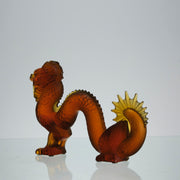 Oriental Dragon by Marie-Claude Lalique A striking mid 20th Century glass study of an Oriental dragon of undulating form with very fine hand chased surface detail and dramatic orange colour