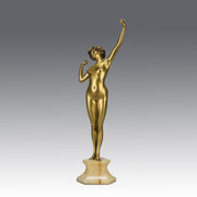 Art Deco Sculpture Le Reveil by Paul Philippe painted gilt and enamel bronze a attractive young woman as she stretches in the morning, raised on a shaped marble base