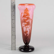 Digitale Vase by Le Verre Francais a striking cameo glass vase decorated with a red and maroon Art Deco design of digitalis flowers against a light pink field