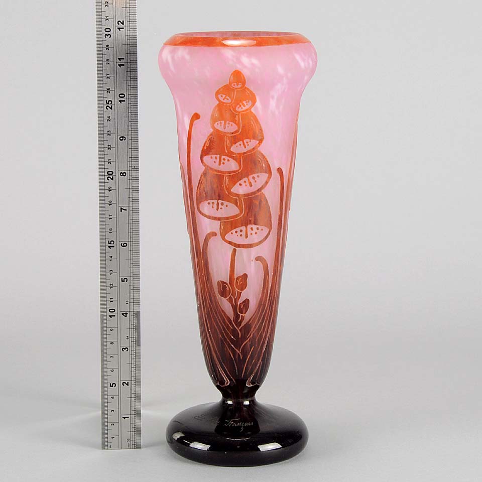 Digitale Vase by Le Verre Francais a striking cameo glass vase decorated with a red and maroon Art Deco design of digitalis flowers against a light pink field