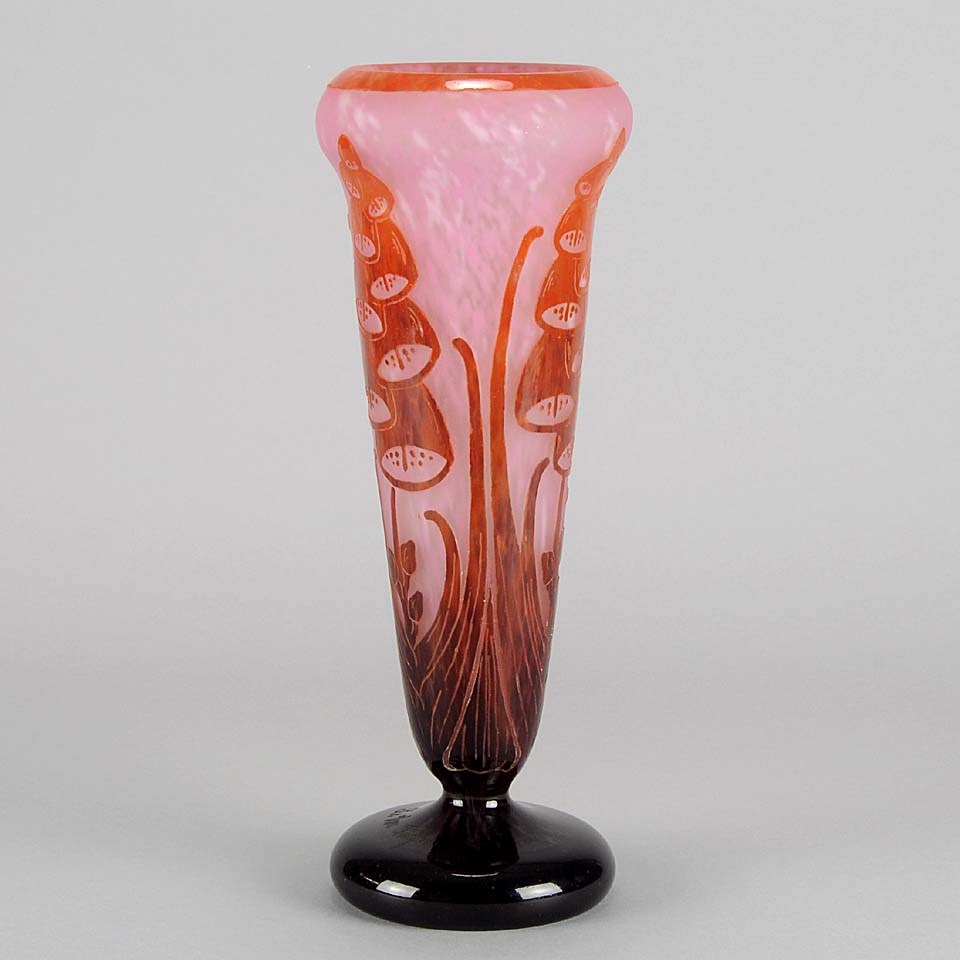 Digitale Vase by Le Verre Francais a striking cameo glass vase decorated with a red and maroon Art Deco design of digitalis flowers against a light pink field