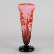 Digitale Vase by Le Verre Francais a striking cameo glass vase decorated with a red and maroon Art Deco design of digitalis flowers against a light pink field