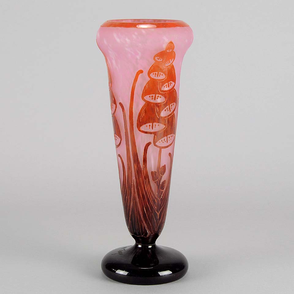 Digitale Vase by Le Verre Francais a striking cameo glass vase decorated with a red and maroon Art Deco design of digitalis flowers against a light pink field