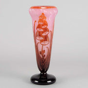 Digitale Vase by Le Verre Francais a striking cameo glass vase decorated with a red and maroon Art Deco design of digitalis flowers against a light pink field