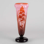 Digitale Vase by Le Verre Francais a striking cameo glass vase decorated with a red and maroon Art Deco design of digitalis flowers against a light pink field