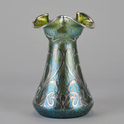 Silvered Papillon Vase by Loetz Witwe Art Nouveau tourquoise papillon glass vase, decorated with an applied silver floral organic pattern that wraps around the circumference of the body