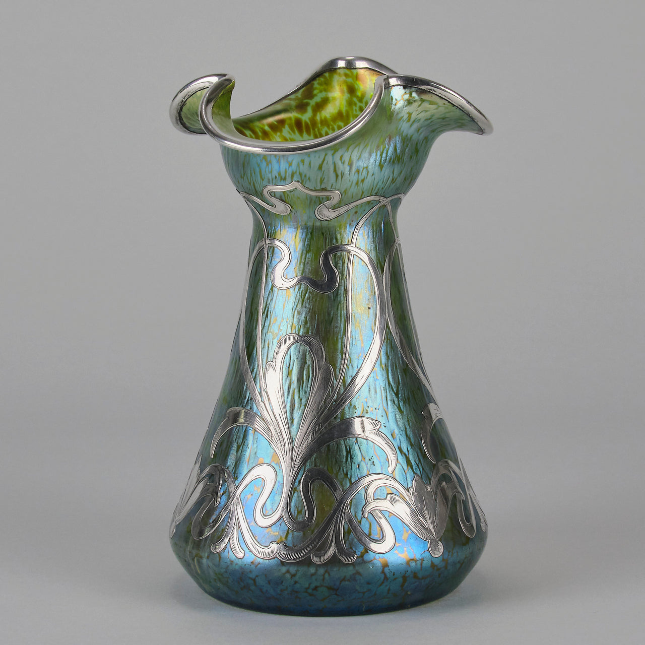 Silvered Papillon Vase by Loetz Witwe Art Nouveau tourquoise papillon glass vase, decorated with an applied silver floral organic pattern that wraps around the circumference of the body