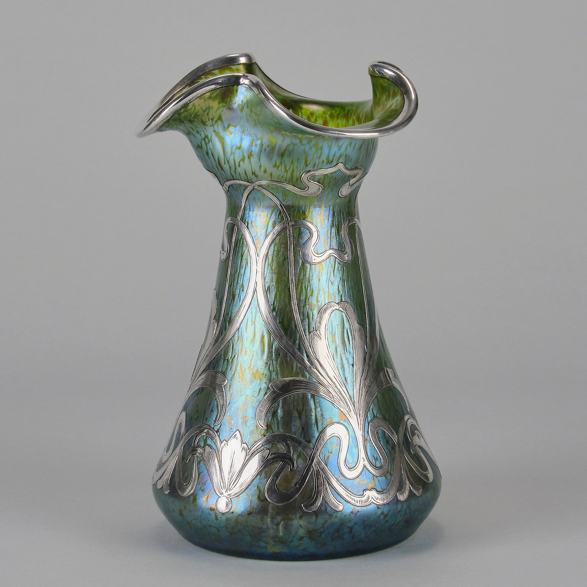 Silvered Papillon Vase by Loetz Witwe Art Nouveau tourquoise papillon glass vase, decorated with an applied silver floral organic pattern that wraps around the circumference of the body