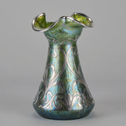 Silvered Papillon Vase by Loetz Witwe Art Nouveau tourquoise papillon glass vase, decorated with an applied silver floral organic pattern that wraps around the circumference of the body