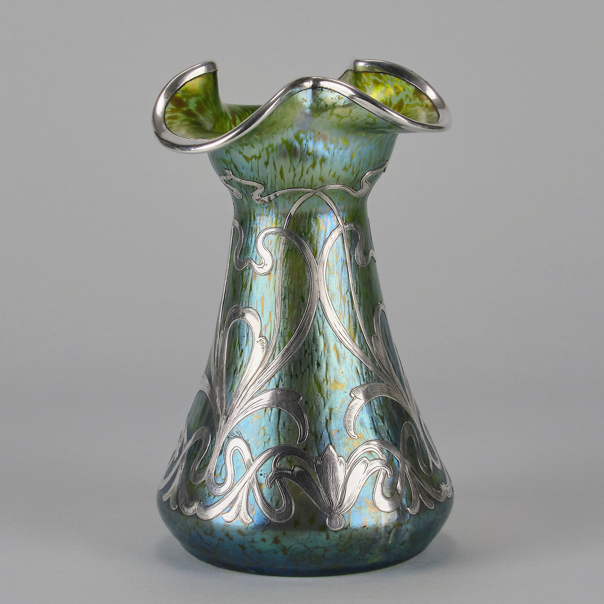 Silvered Papillon Vase by Loetz Witwe Art Nouveau tourquoise papillon glass vase, decorated with an applied silver floral organic pattern that wraps around the circumference of the body
